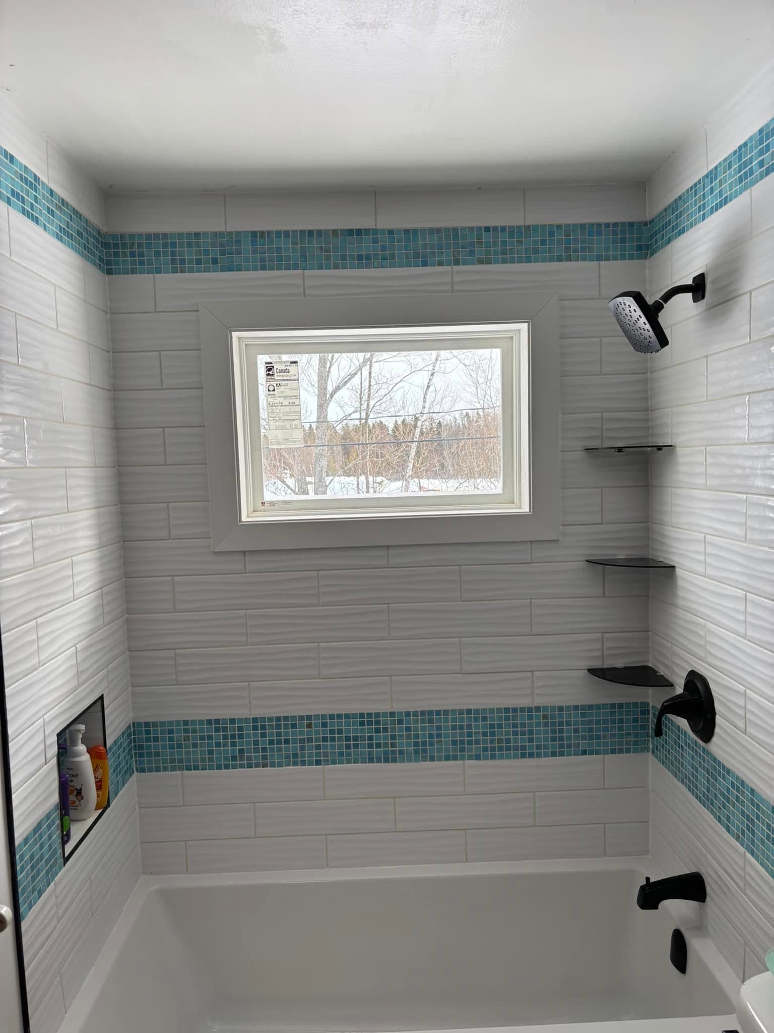 Remodeled bathroom shower with new tile